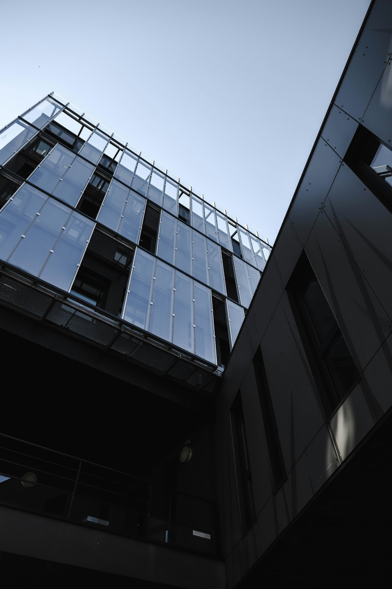 Modern professional building with glass and steel architecture representing corporate stability